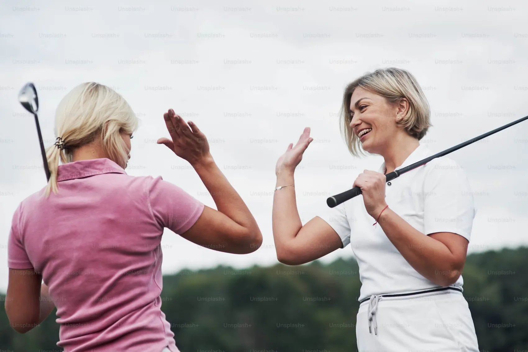 Female golfer demonstrating flexibility and mobility exercises